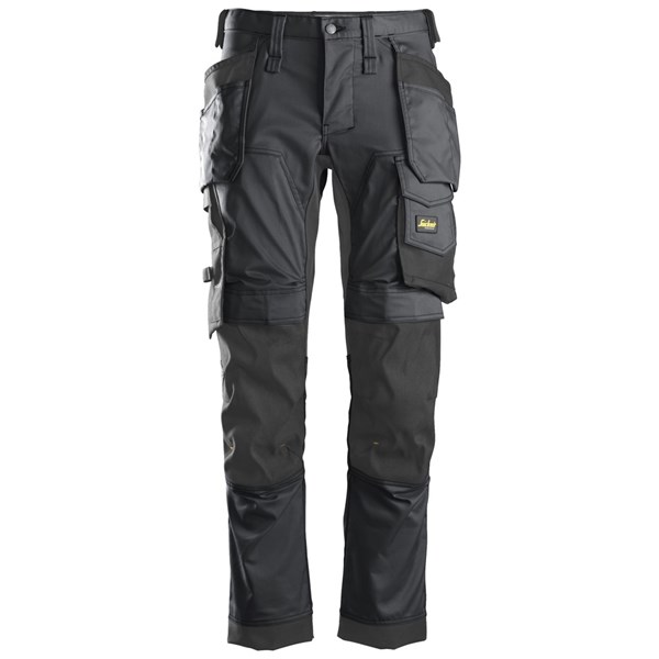 A pair of black work trousers with multiple pockets, reinforced knees, and a tool loop, designed for durability and utility.