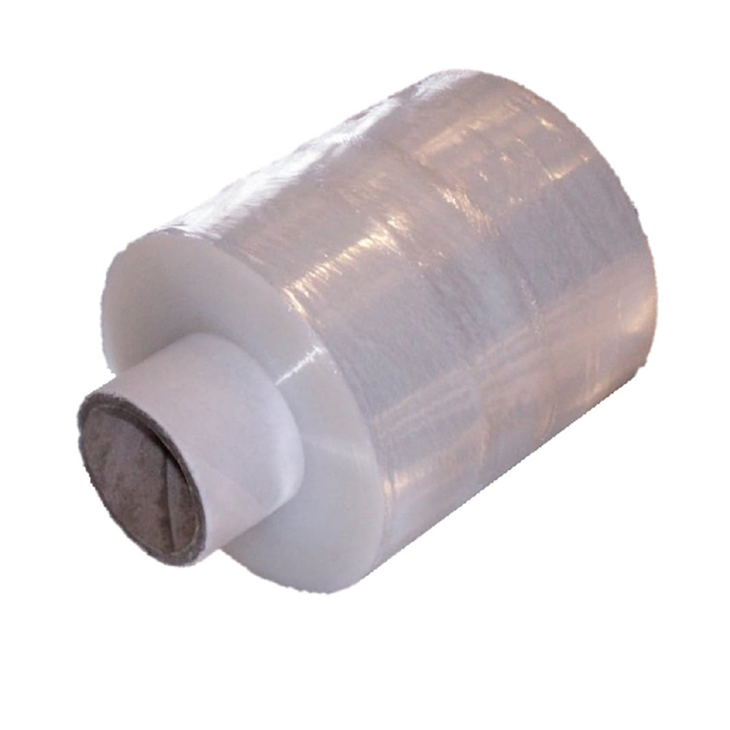 A roll of Handy Wrap Hand Pallet Wrap 100mm x 300m, clear with a cardboard core, is placed on a white background.