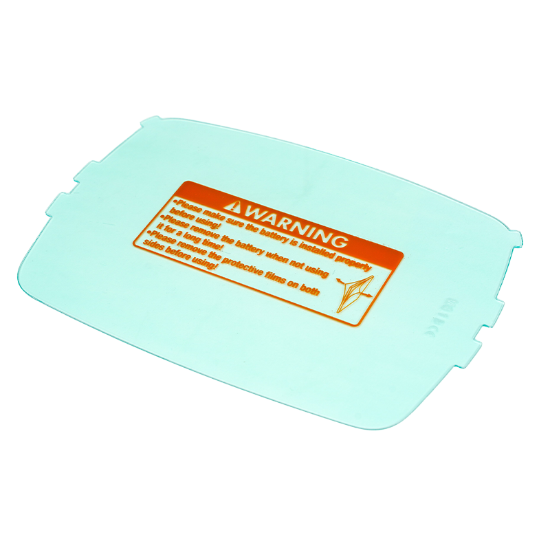 A clear rectangular plastic sheet with clips on the sides and an orange warning label in the center, advising to remove the protective film before use.