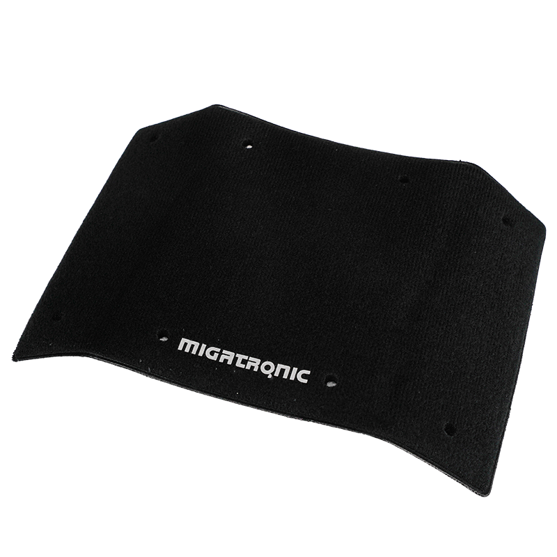 A black rectangular welding helmet cover with rounded corners and the word MIGATRONIC printed in white near the bottom center. There are small holes along the edges of the cover.