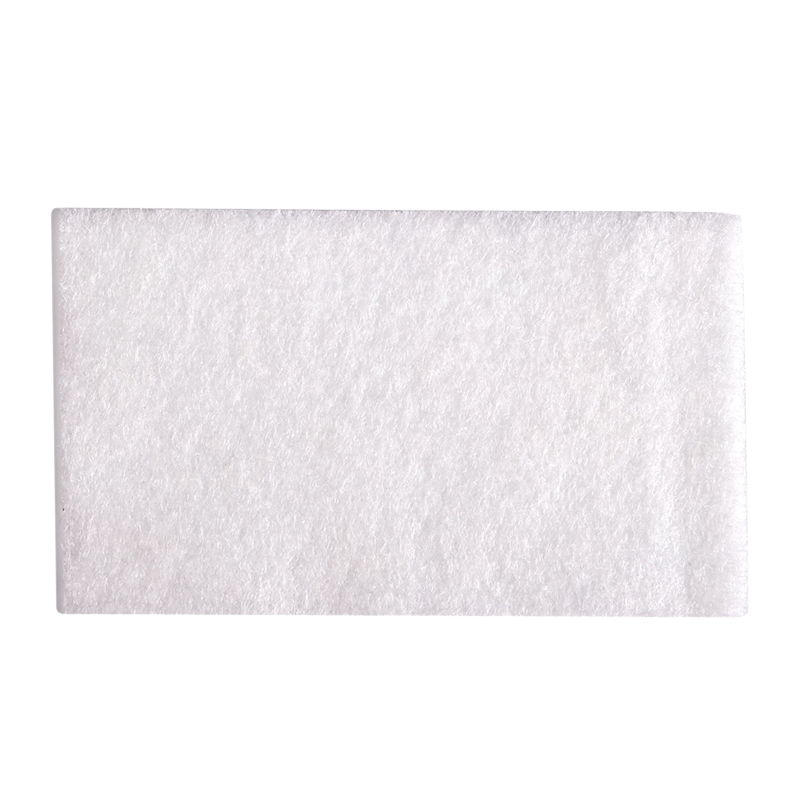 A rectangular, white, textured pad with soft and fuzzy appearance, placed against a plain white background.