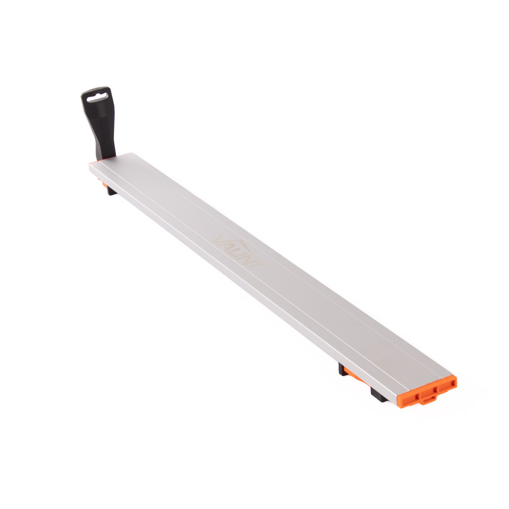 A long, rectangular metal cutting guide with an orange end and a black plastic handle attached to one side, designed for use with saws or other cutting tools.