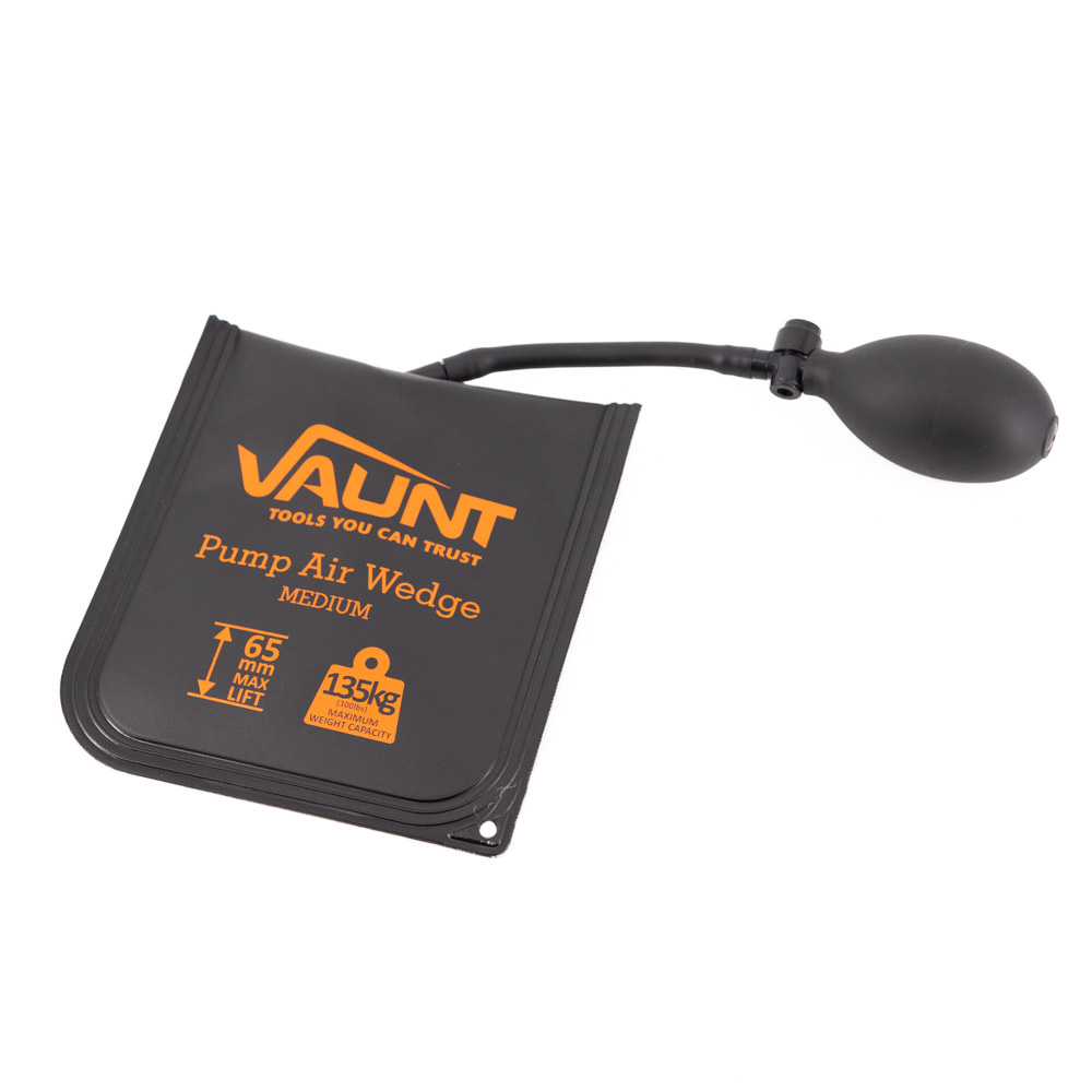 A black Vaunt pump air wedge with an attached hand pump bulb, used for lifting or spacing objects. The wedge has orange text showing its capacity (135kg) and size (65mm lift).