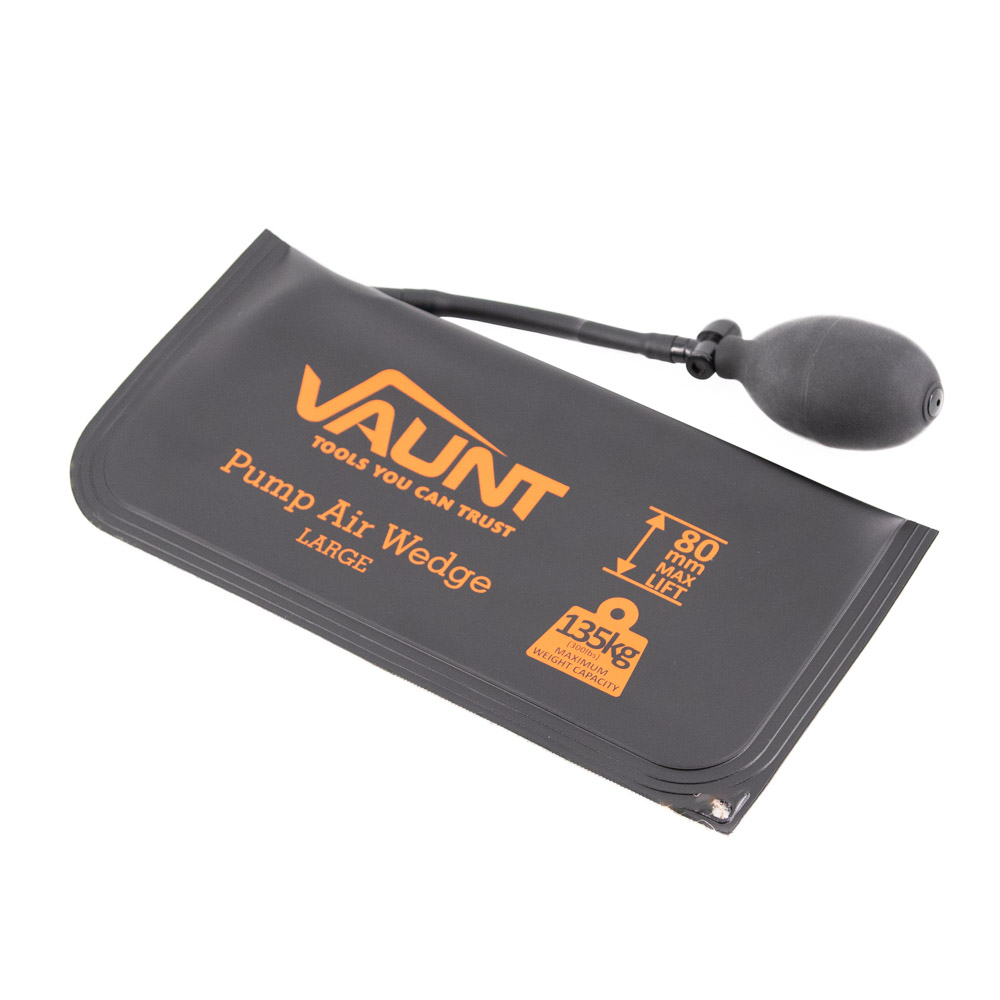 A black Vaunt pump air wedge with an attached hand bulb for inflating. The wedge is labeled with specifications: large size, 80mm lift, and 135kg load capacity.
