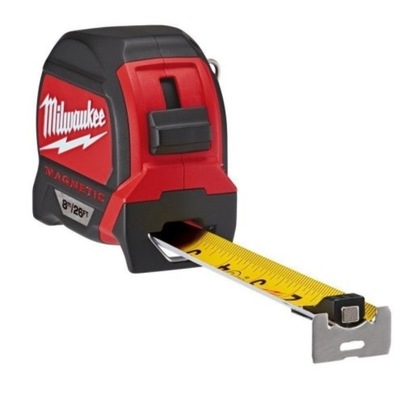 A red and black Milwaukee magnetic tape measure with the yellow measuring tape extended, showing black measurement markings and a metal hook at the end.