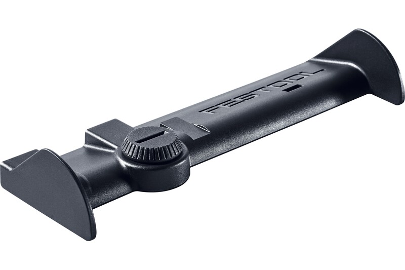 A black Festool tool accessory with a central adjustment knob, flat rectangular body, and angled ends, designed for precise positioning or support in woodworking or construction tasks.