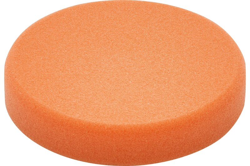 A round, orange foam pad with a smooth texture, viewed from a slight angle against a white background.