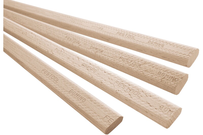 Four light-colored wooden dowels with patterned surfaces, each labeled FESTOOL DOMINO, are arranged diagonally against a white background.