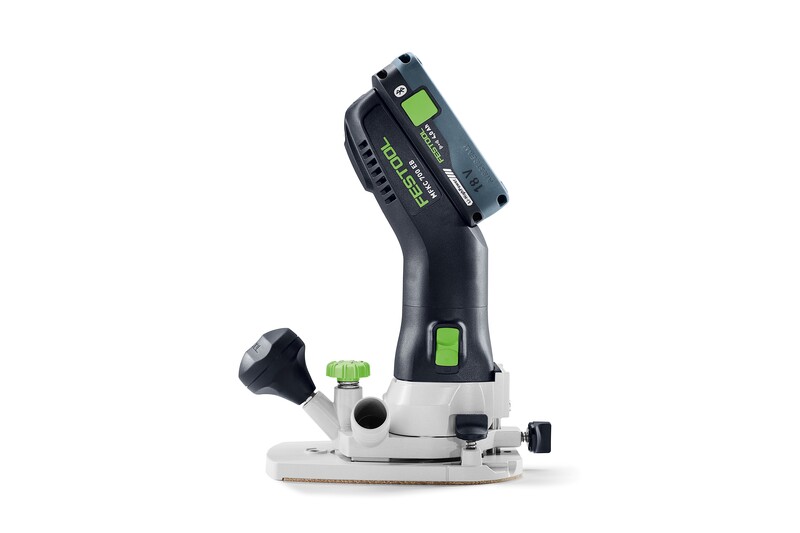 The Festool 578120 Cordless Joining Machine DOMINO DFC 500 E-Basic features a black and green handle with a top battery pack, highlighting innovative design, shown against a white background.