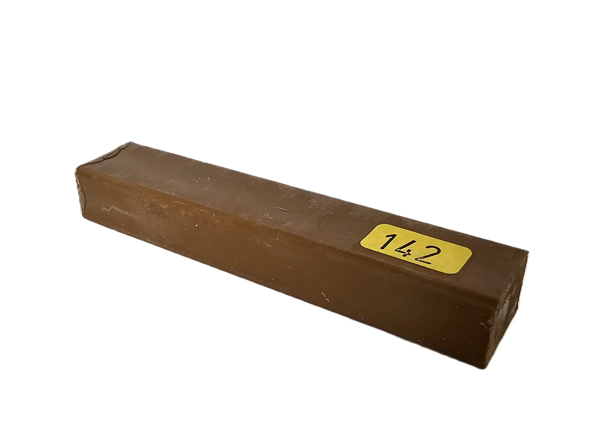 A single, rectangular brown Konig 8cm Hard Wax Filler Stick Medium Oak is shown with a yellow label, against a white background.