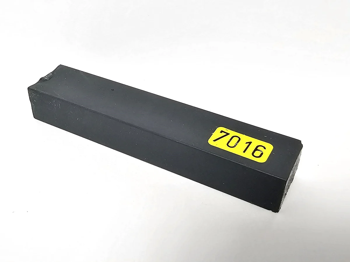 A rectangular Konig 8cm Hard Wax Filler Stick 142 Medium Oak, single bar with a chipped corner and yellow label on white background.