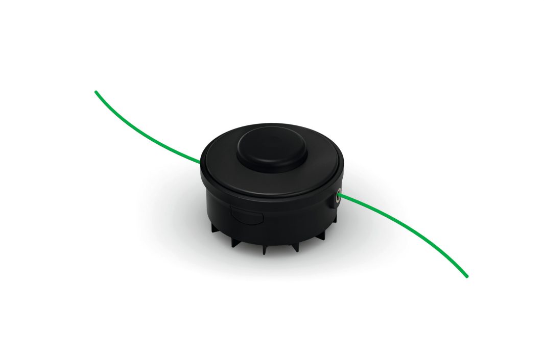 A black trimmer head with green nylon line extending from both sides, designed for a string trimmer, on a white background.