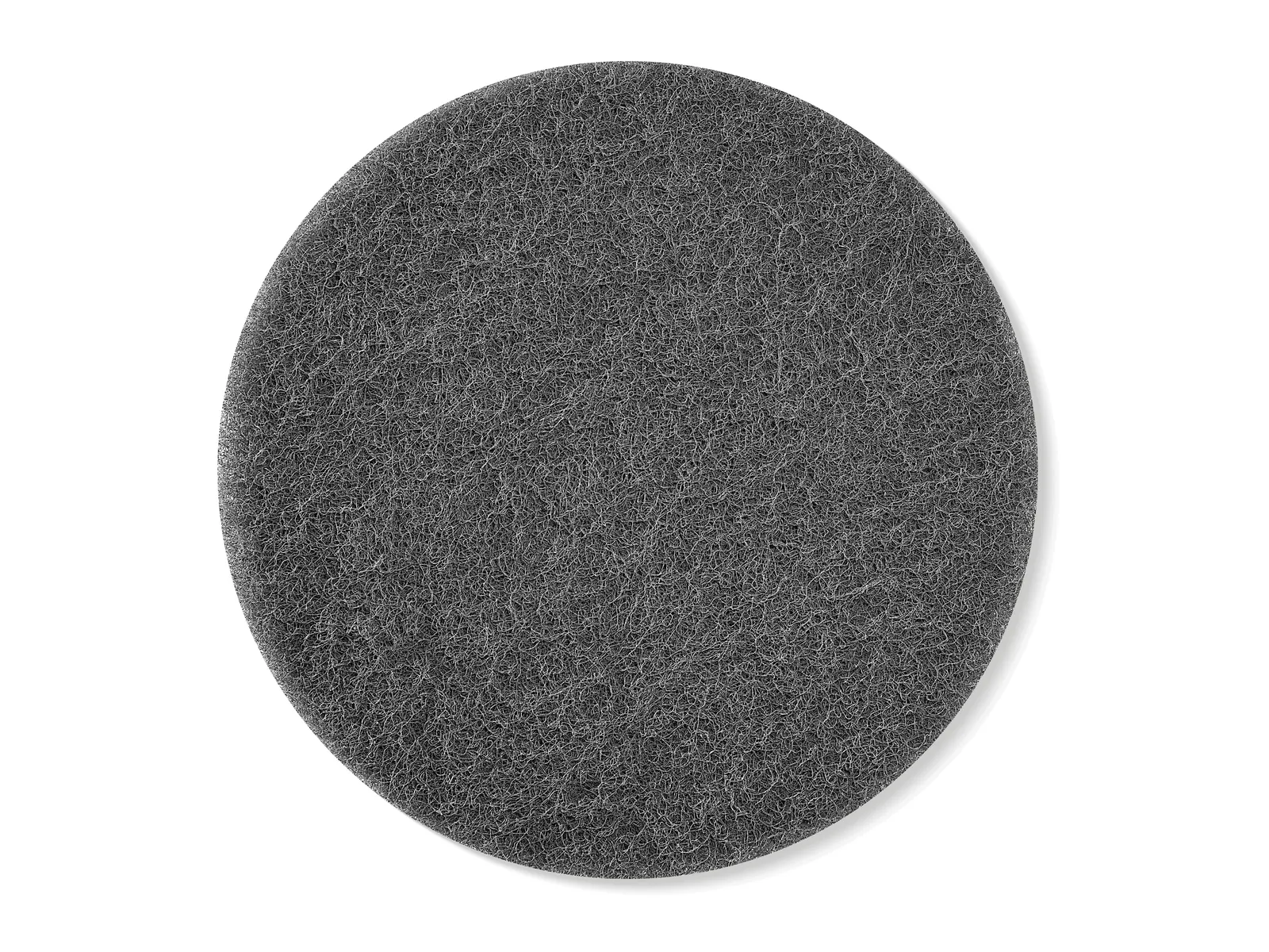 A round, black scouring pad with a rough, textured surface on a white background.