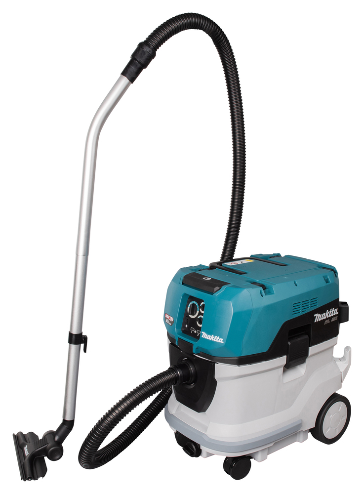 The Makita VC006GM 40Vx2 M-Class Dust Extractor is a blue and white wet/dry vacuum cleaner with wheels, hose, and metal extension tube.