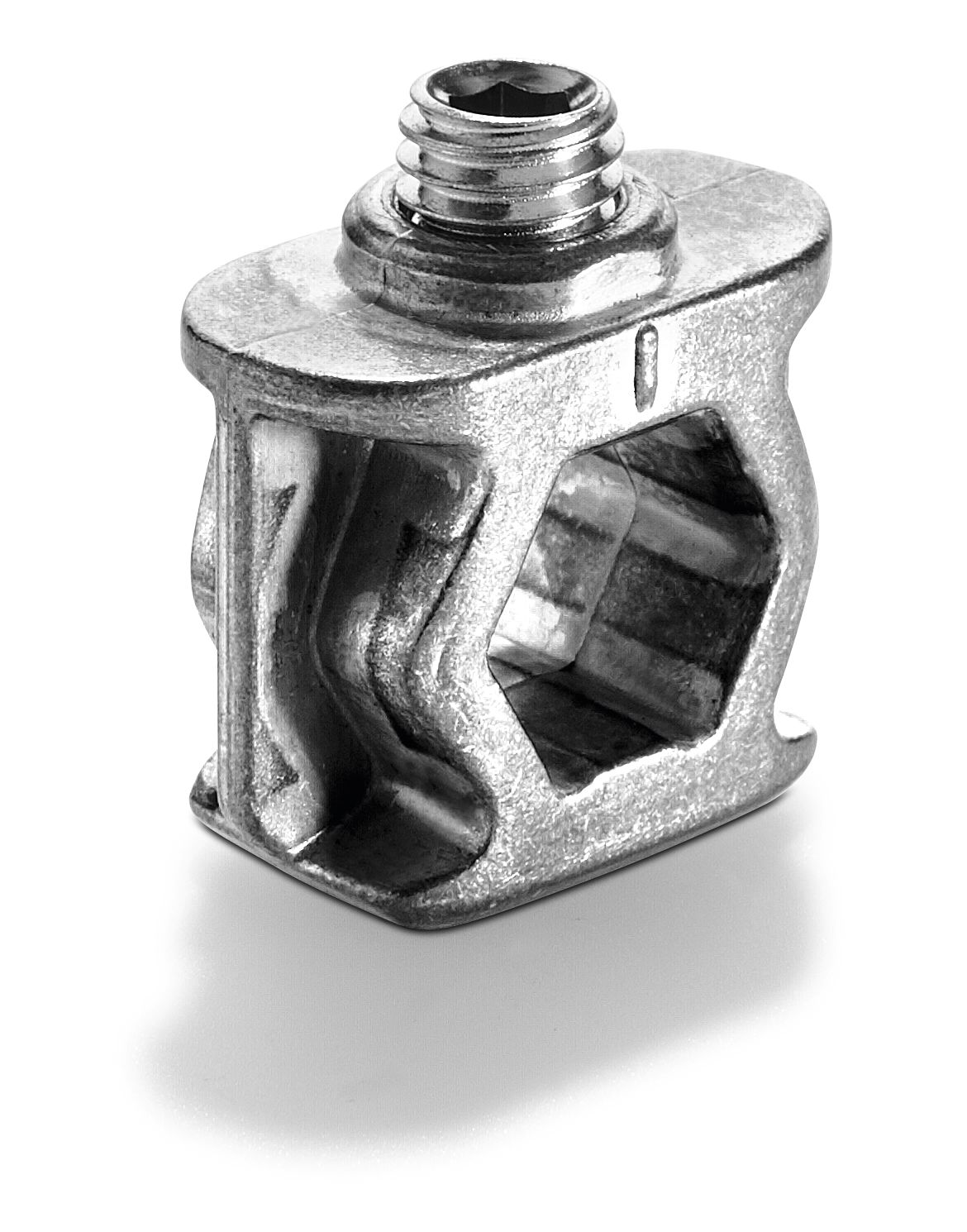 A close-up of a metal T-nut with a hexagonal hole and threaded top, used in industrial or construction settings on a white background.