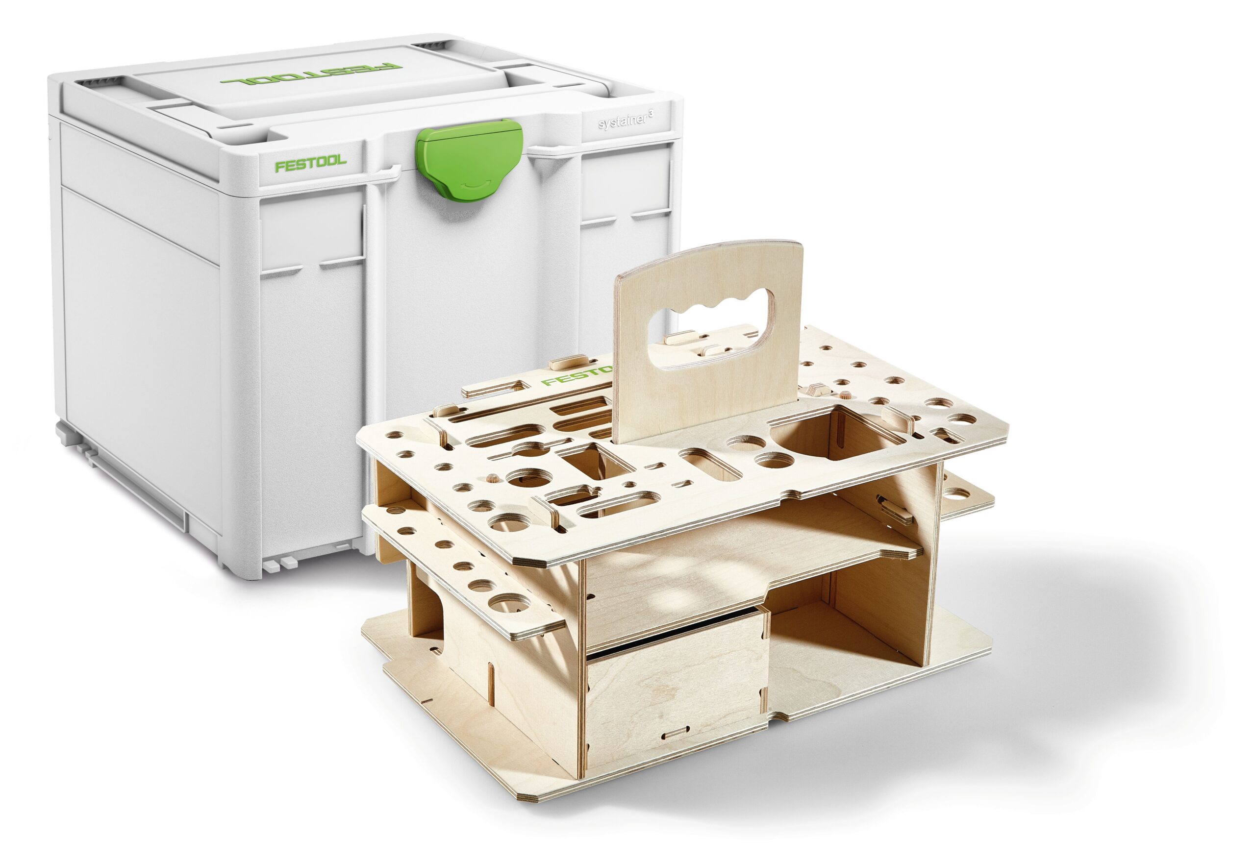 A white Festool storage box sits behind a compact wooden tool organizer with multiple slots, holes, compartments, and a top handle.