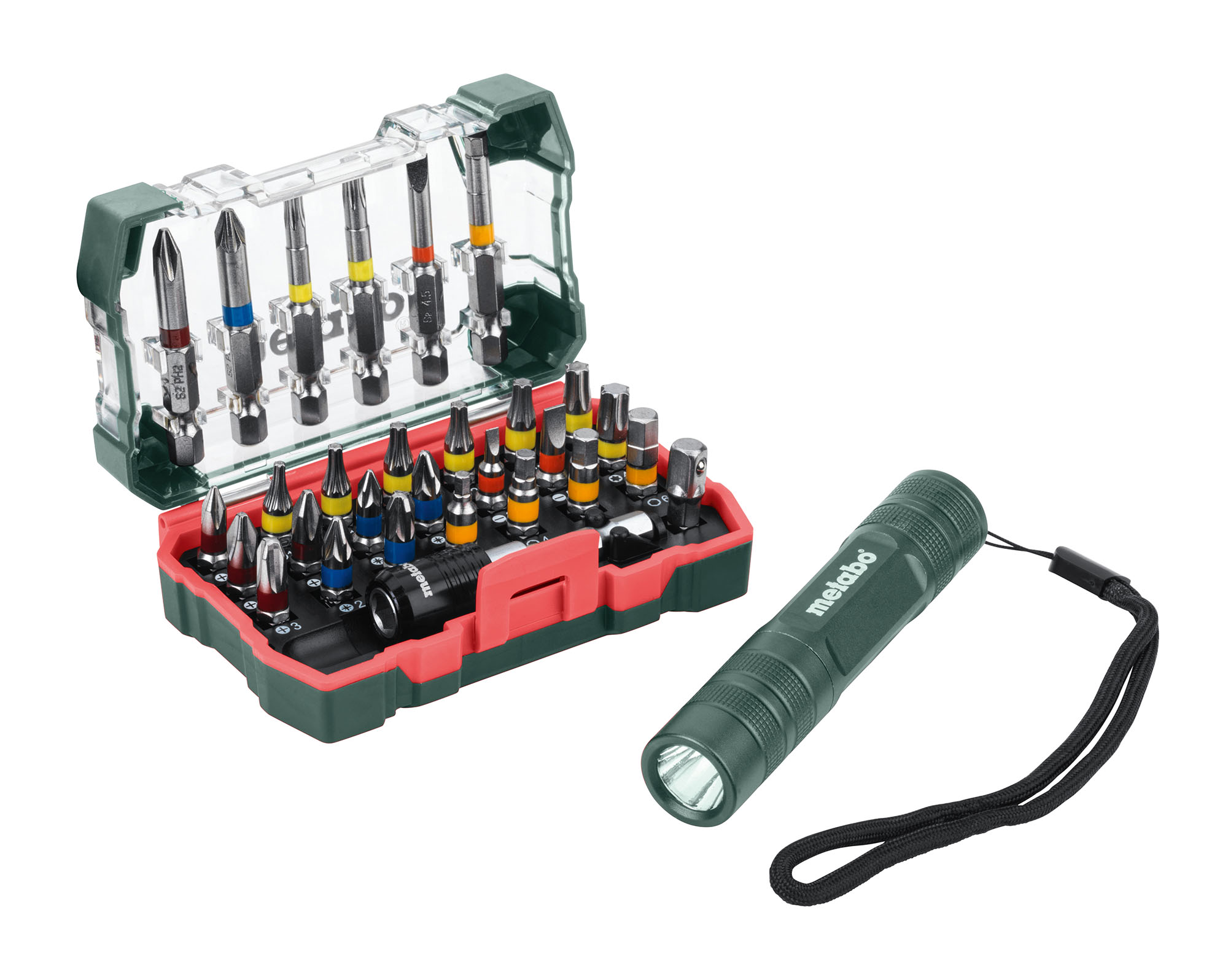 A compact tool kit with multiple screwdriver bits in a plastic case sits beside a green handheld flashlight with a wrist strap.