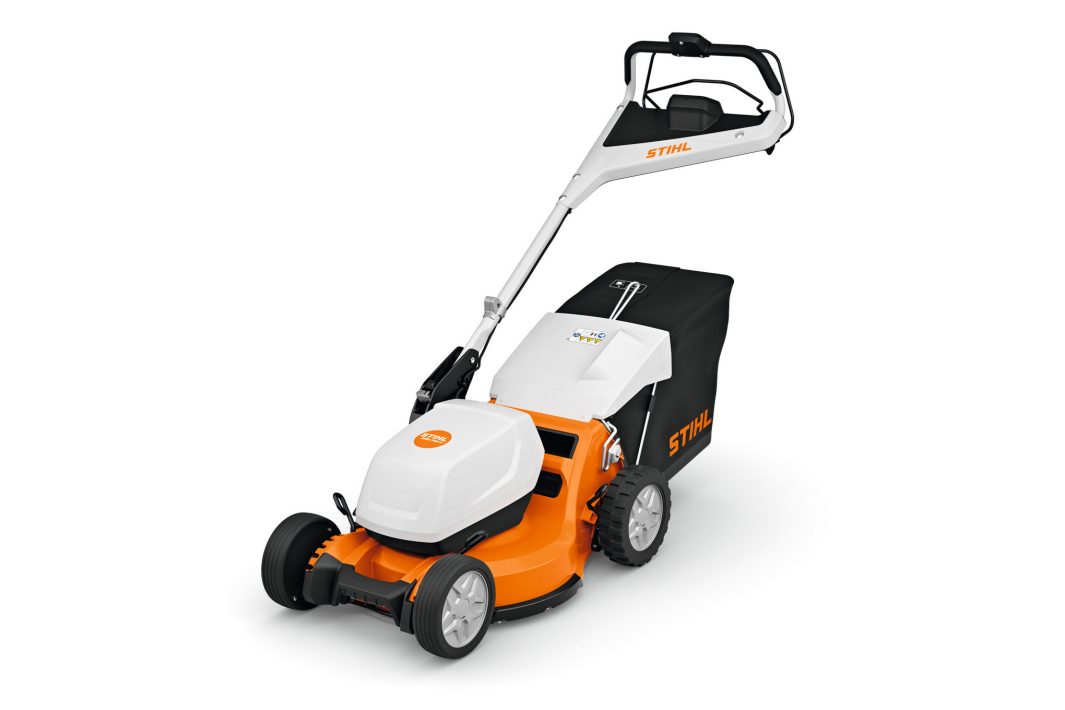 The Stihl RMA 750.0 V (AP) Lawnmower is a modern orange and white mower with black handlebar and grass bag on a white background.