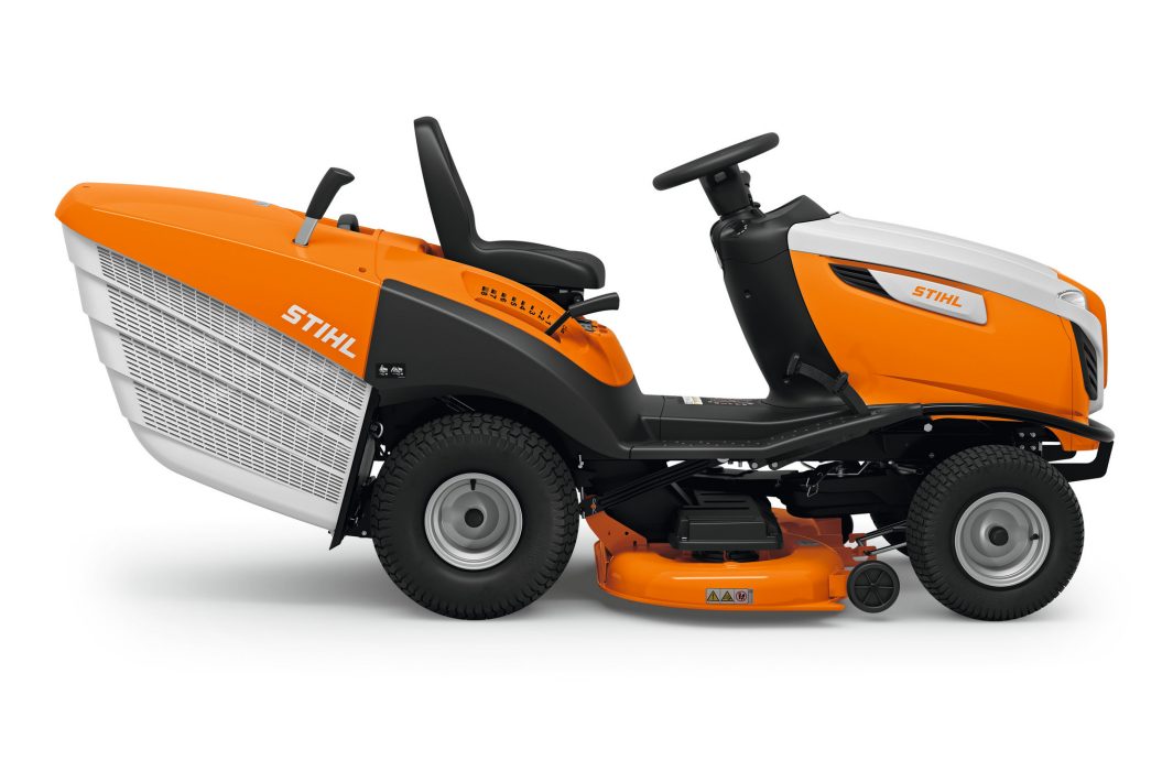 Side view of the Stihl RT 6112.1 ZL Ride-on Mower in orange and white with a seat, steering wheel, and visible cutting deck beneath.