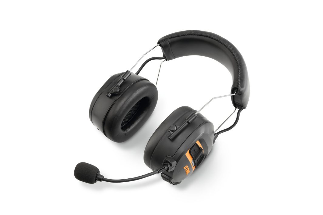 Black over-ear headset with cushioned ear cups, adjustable headband, microphone, and orange switch on a white background.