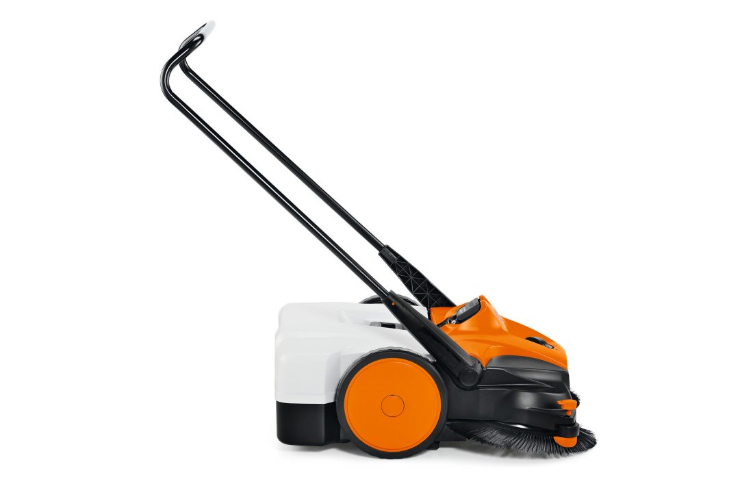 A side view of a Stihl KGA 770.0 (AP) Sweeper with two large wheels, a black handle, and front rotating brushes.
