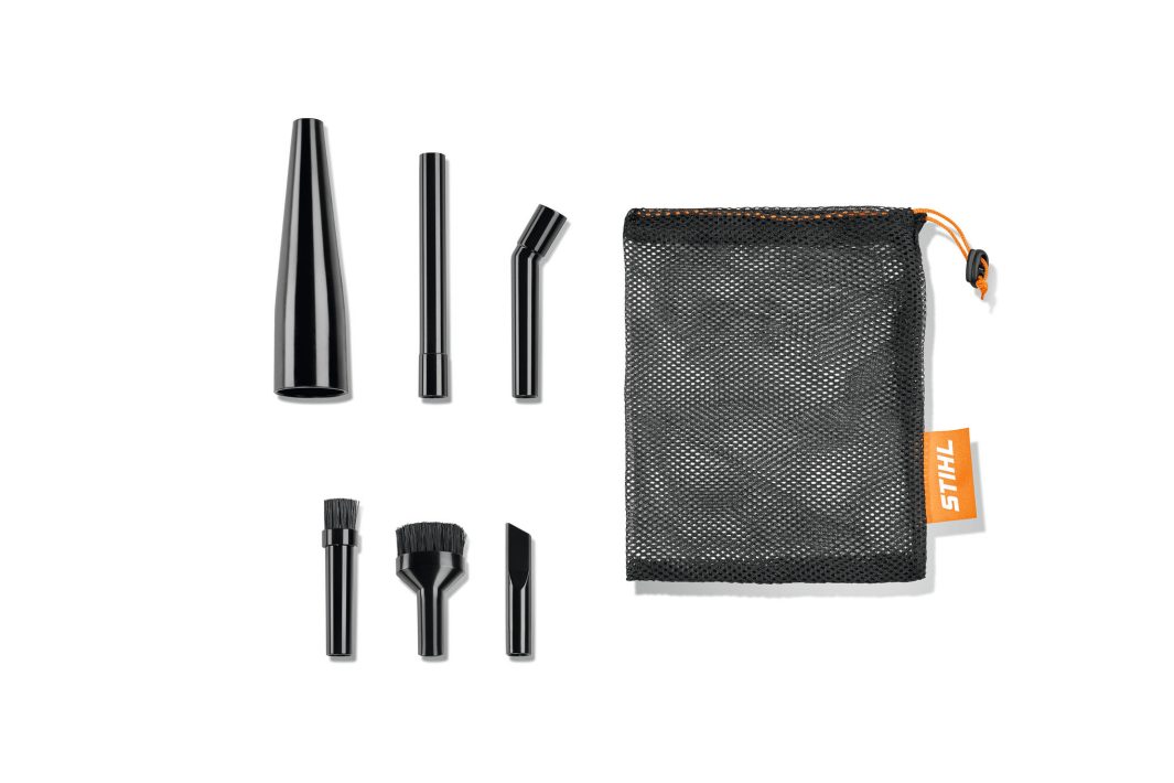 The Stihl SEA 20 Mini Nozzle Kit features six black attachments and a mesh pouch with an orange label, on a white background.