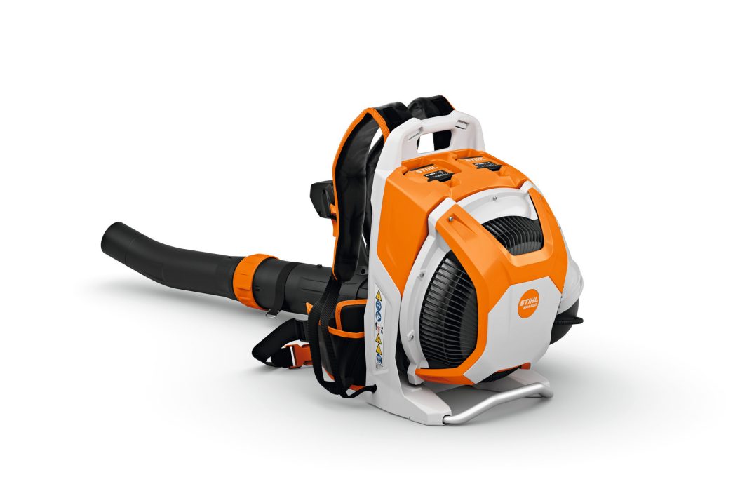 The Stihl BRA 600.0 (AP) Backpack Blower has a bright orange and white body, black straps, padded harness, and a large black nozzle.