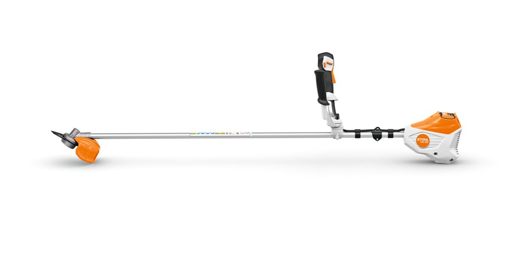 A Stihl orange and white strimmer with straight shaft, adjustable handle, and protective guard on a white background.