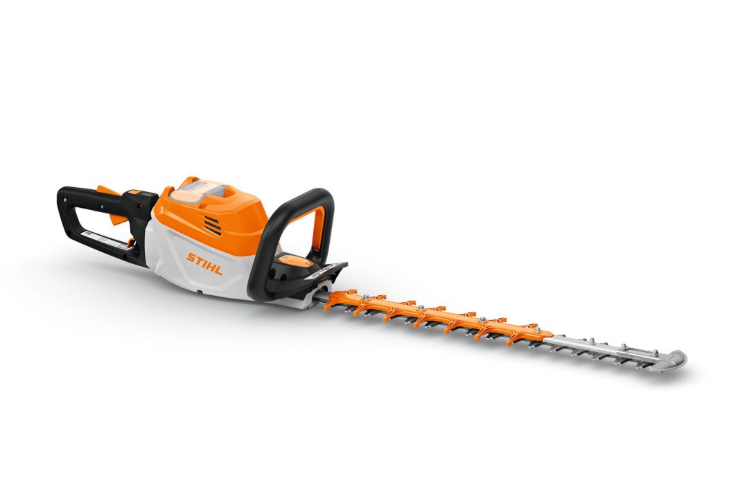 A cordless hedge trimmer with an orange, white, and black body and a long silver blade is shown on a white background.
