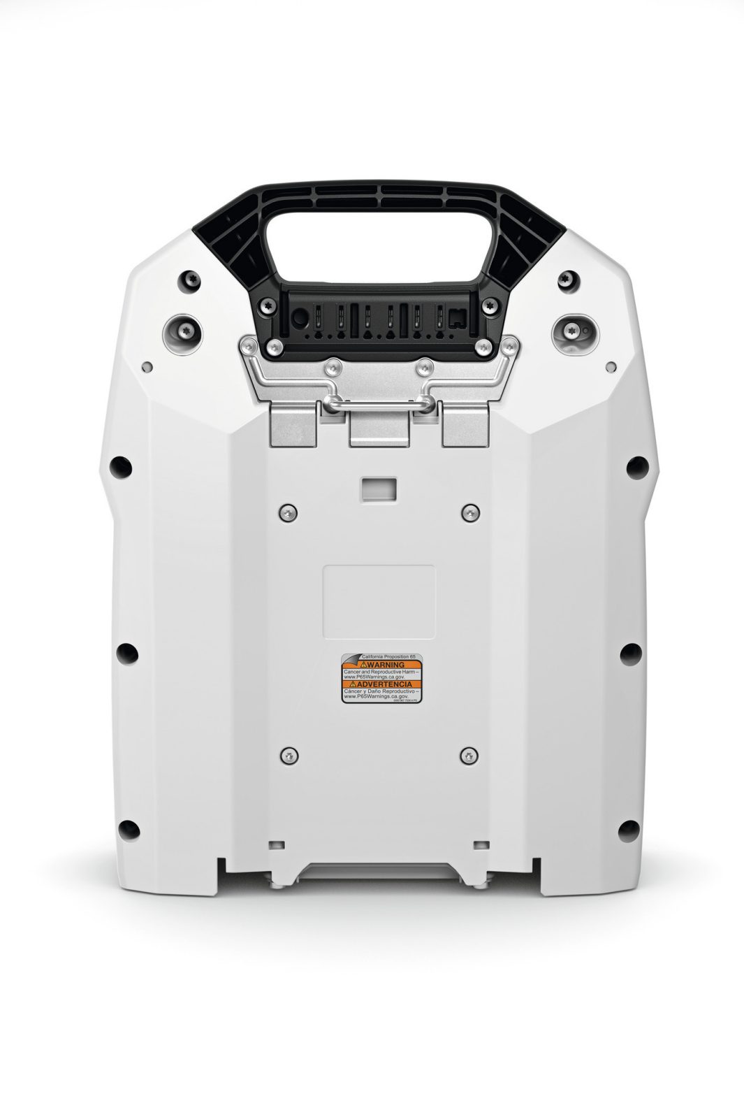 Rear view of a rugged white electronic device featuring a black handle, multiple ports, screws, and a caution label on white background.