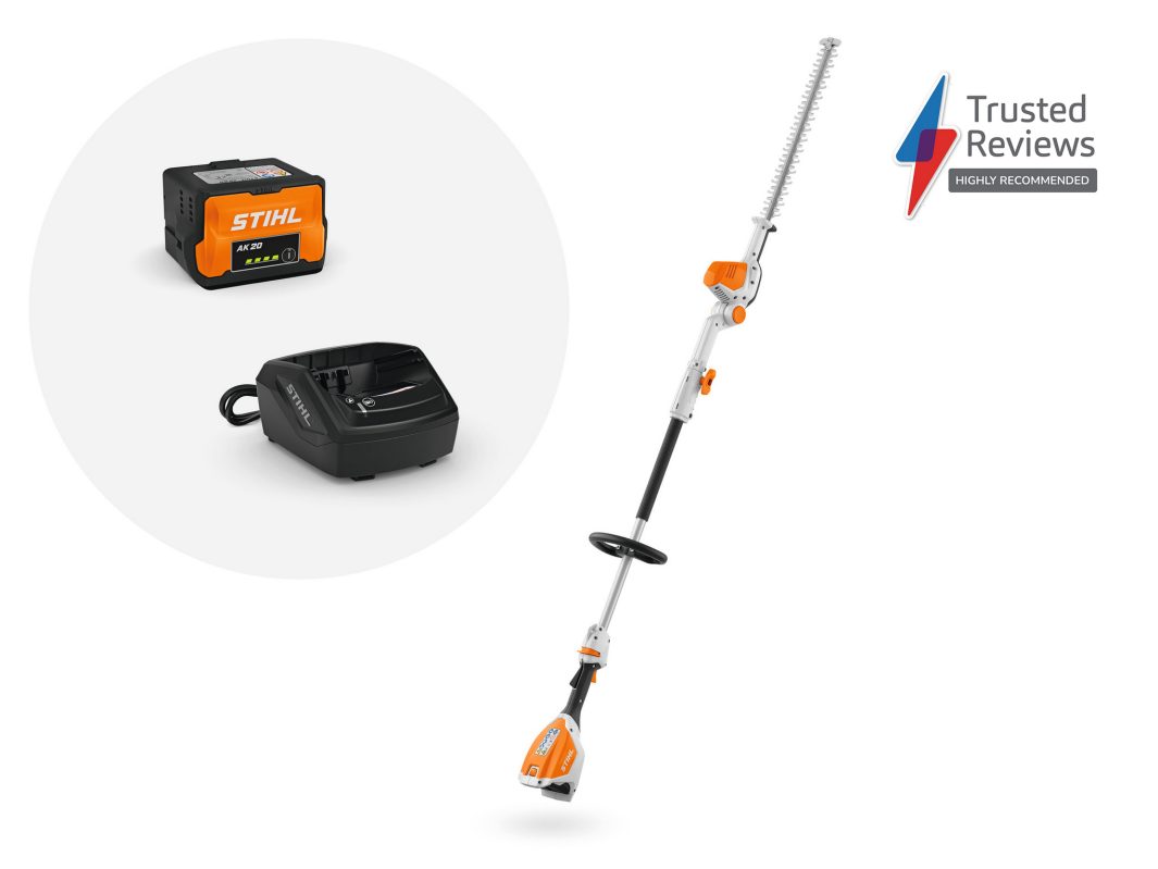 A STIHL cordless hedge trimmer with an adjustable pole, shown alongside a battery and charger.