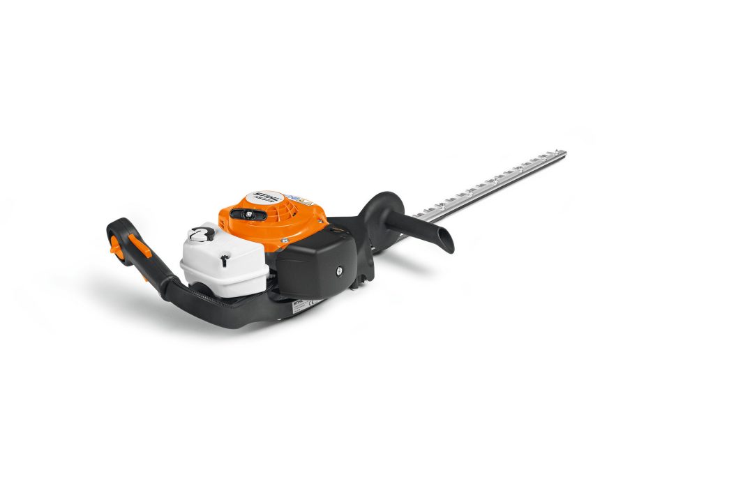 A Stihl HS 87 R 75cm/30" hedge trimmer with an orange and white engine, long silver blade, and black handles on a white background.