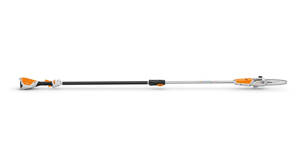 The Stihl HTA 50 Pole Pruner KIT has an orange and white motor, long black pole, and compact chainsaw blade for trimming branches.