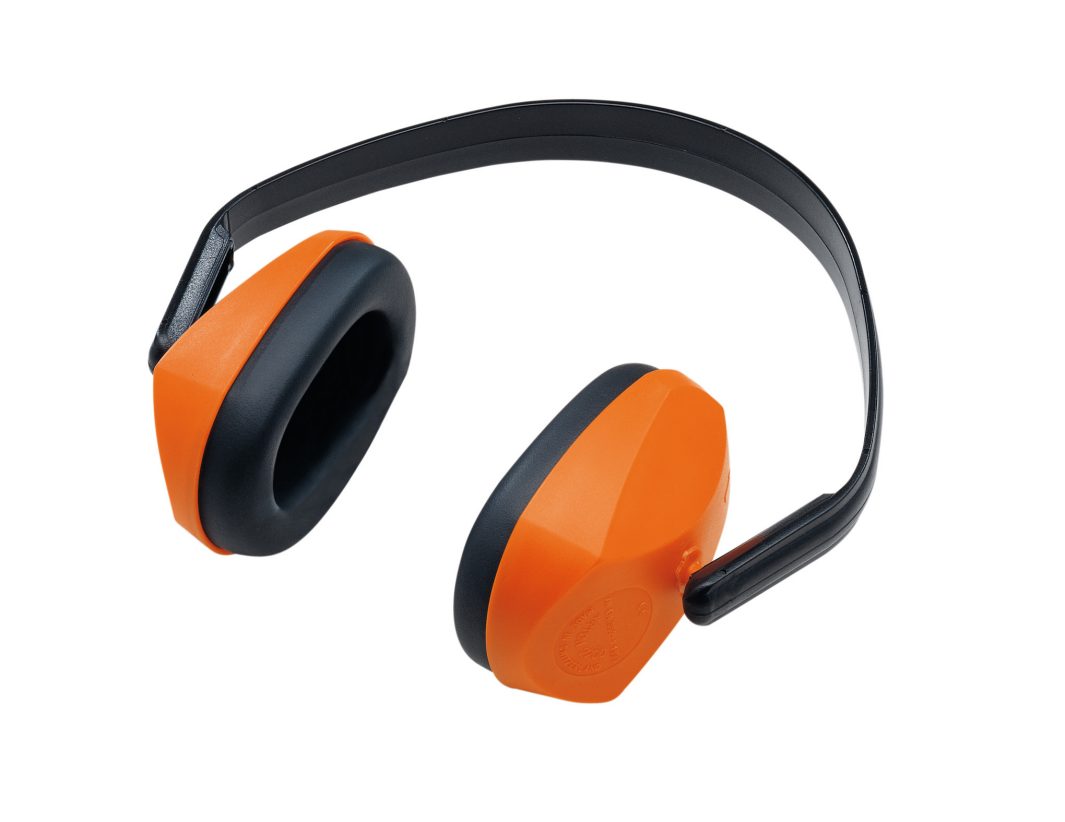 Orange and black over-ear hearing protection ear muffs with a black headband, designed to reduce loud noises, on a white background.
