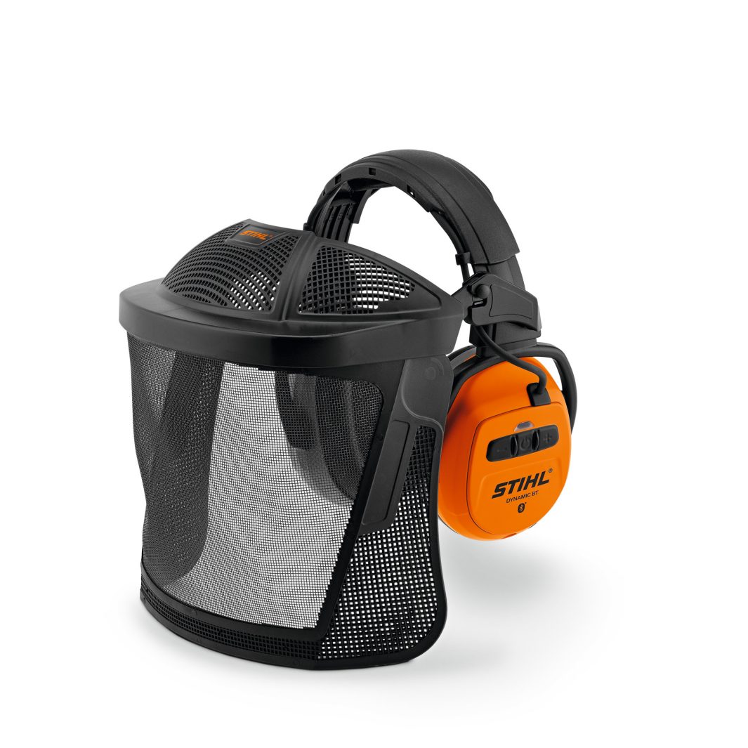 Protective face shield with black mesh visor and orange ear defenders for outdoor safety work; the background is white.