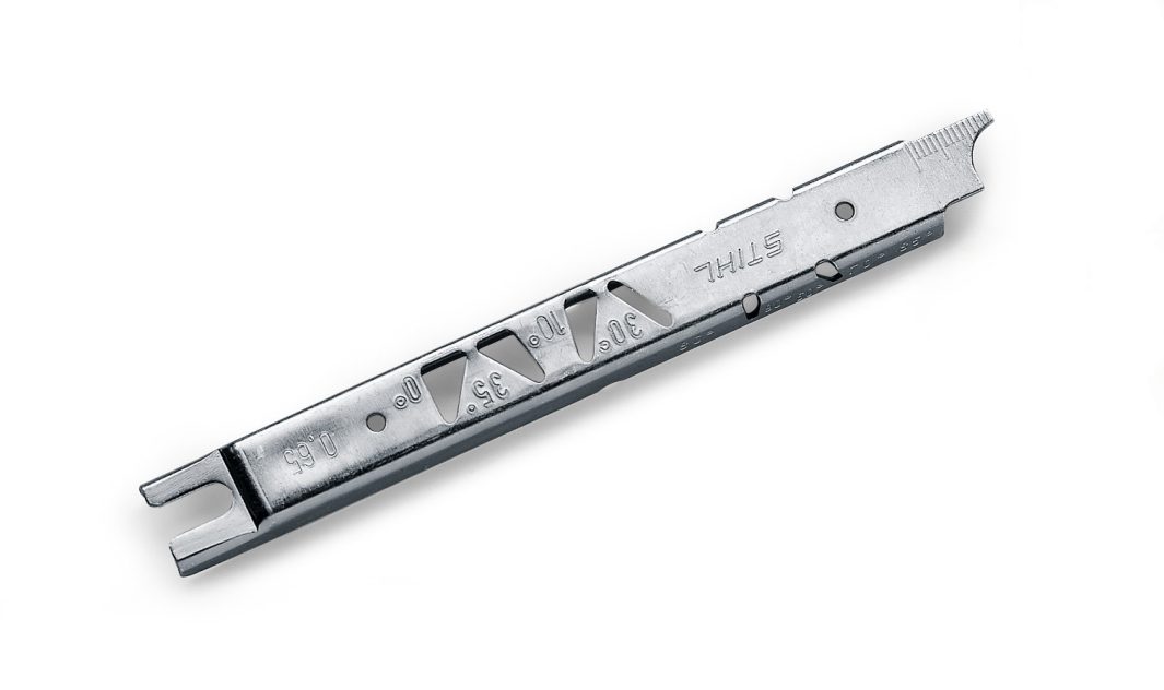 A silver-coloured Stihl chainsaw depth gauge tool with various measurement markings and notches is displayed on a white background.