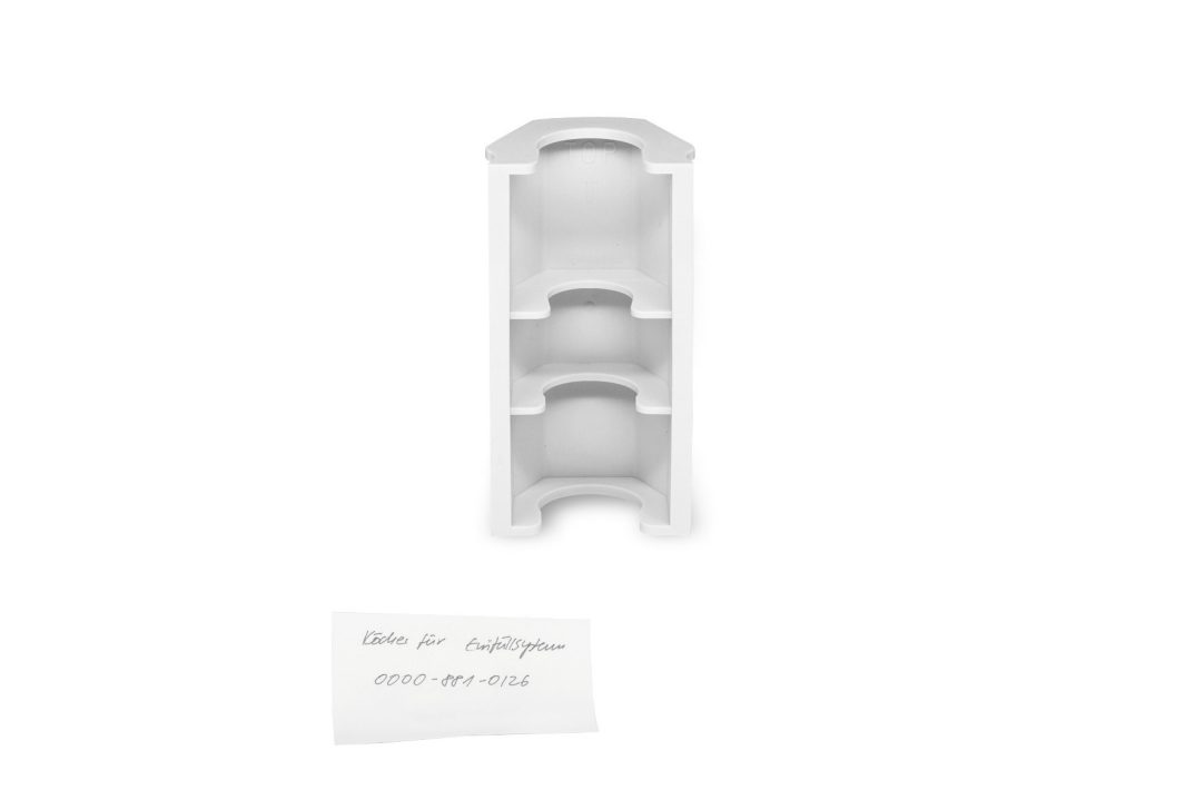 A white, three-tier, curved shelving unit stands upright on a plain background.