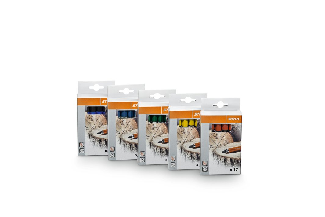 Five boxes of STIHL marking crayons are arranged in a row, each box showing a different colour: blue, red, green, yellow, and orange.