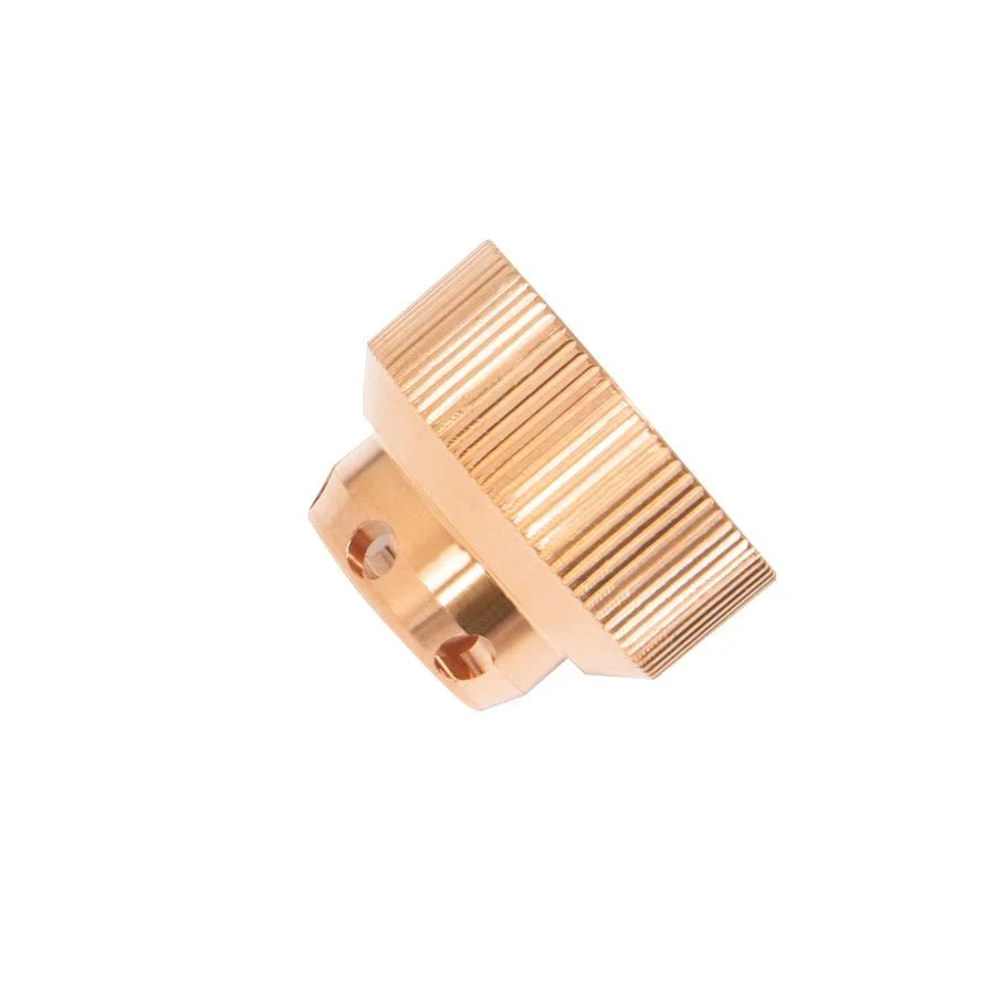 A close-up of a gold-coloured, ridged Star Parts Shield Cap 45A Precision Cut, cylindrical with multiple grooves on white background.