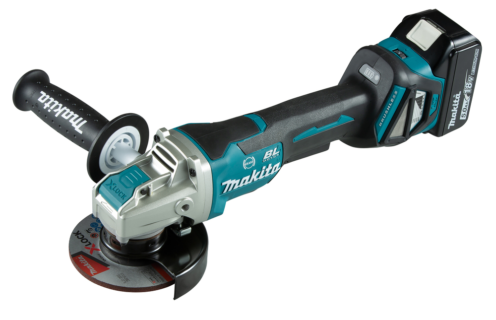 A cordless Makita angle grinder with a black and teal body, side handle, battery pack, grinding disc, and safety guard on the front.