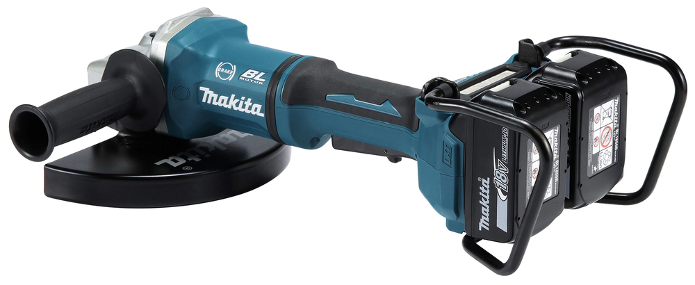 A Makita cordless angle grinder with a side handle, blue body, black wheel guard, and two lithium-ion batteries fitted.