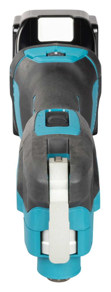 Top view of a cordless electric power tool in black and teal, with a trigger, metallic front part, and battery compartment at the back.