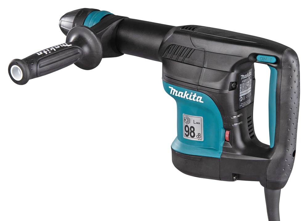 A Makita electric power tool with a side handle and digital noise display, black with teal accents, for heavy-duty drilling or hammering.