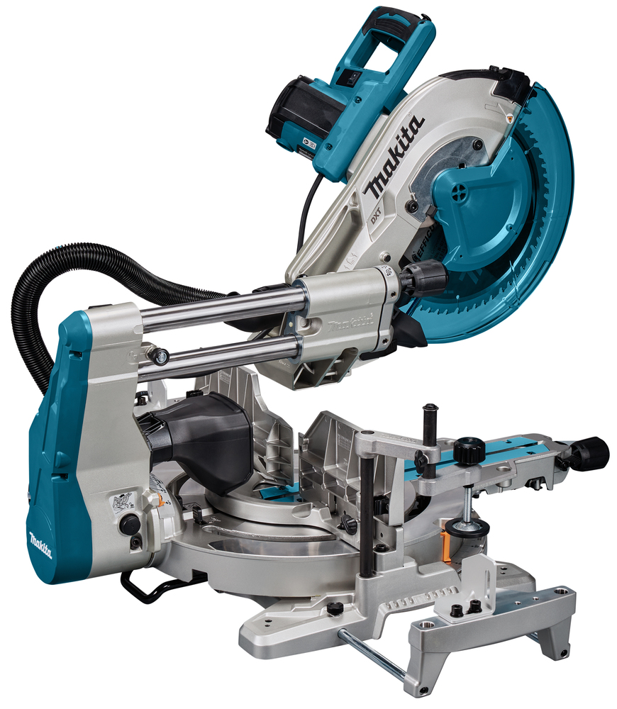 A Makita cordless sliding compound mitre saw with teal and silver accents, large blade, adjustable arm, hose, and adjustment handles.
