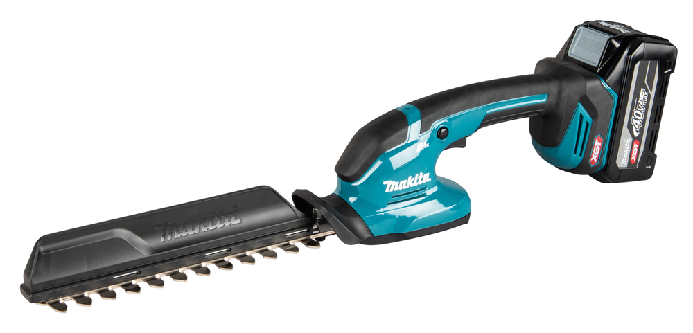 A cordless Makita hedge trimmer featuring a black and teal body, protective blade cover, and rechargeable battery fitted at the back.