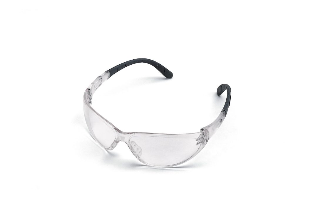 Clear safety glasses with transparent lenses and black, curved earpieces on a white background.