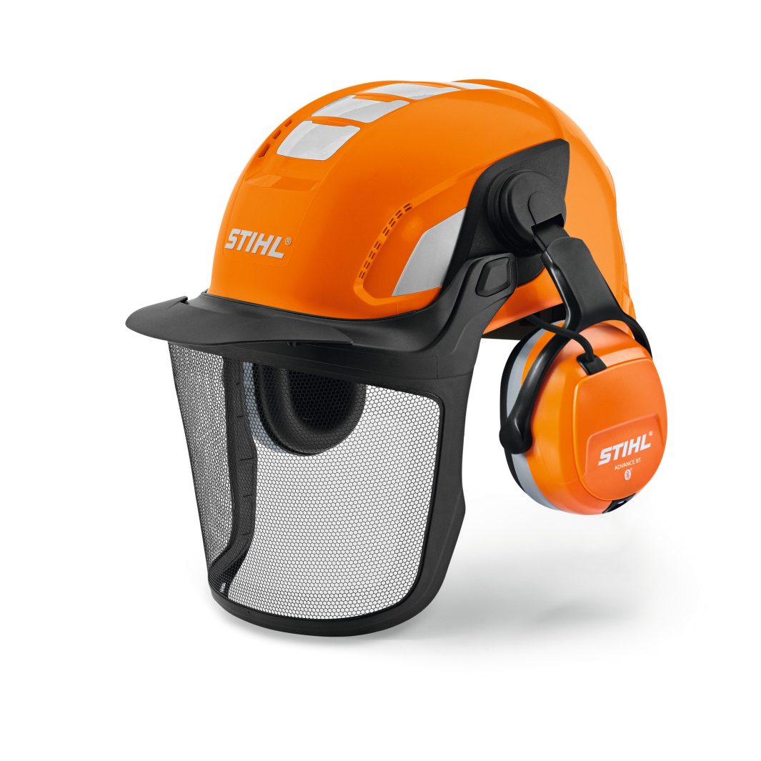 An orange STIHL safety helmet featuring a mesh visor and ear defenders, intended for outdoor or forestry work.