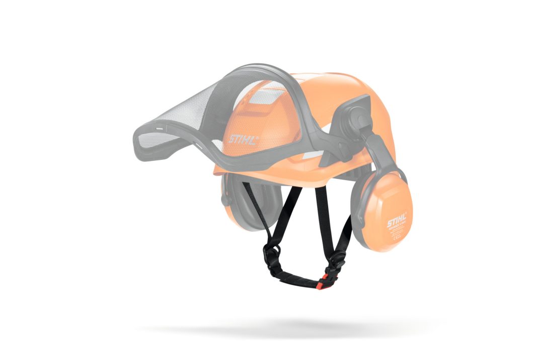 An orange STIHL safety helmet with attached ear muffs, chin strap, and mesh face shield on a white background.
