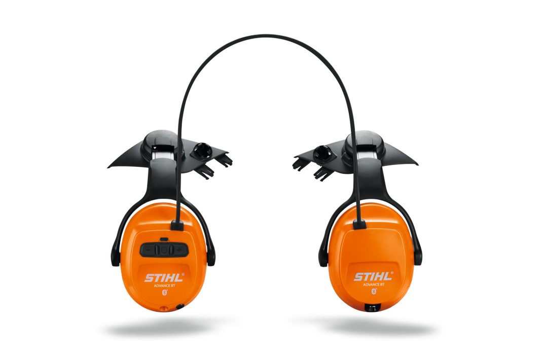 A pair of orange and black STIHL ear defenders with a thin black headband for hearing protection, shown against a plain white background.