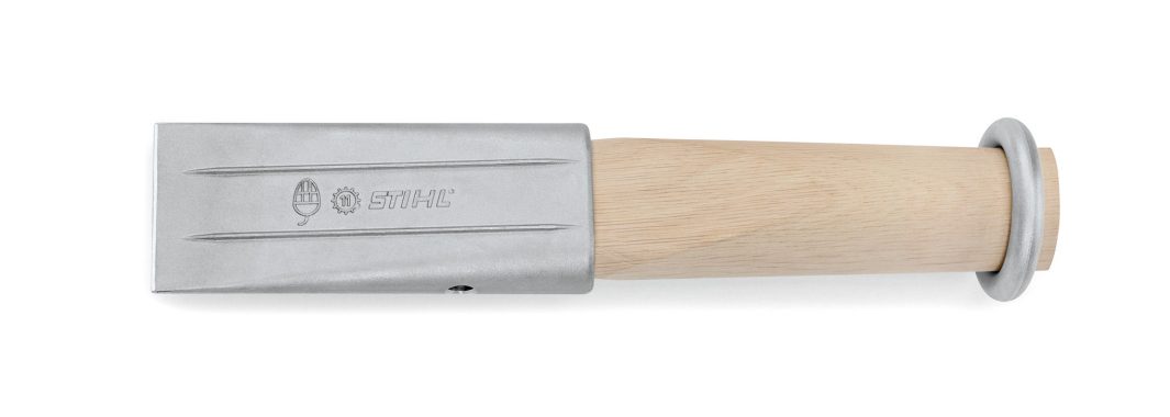 A metal splitting wedge with a light wooden handle and a round metal guard. The wedge features a flat blade and notched grooves.